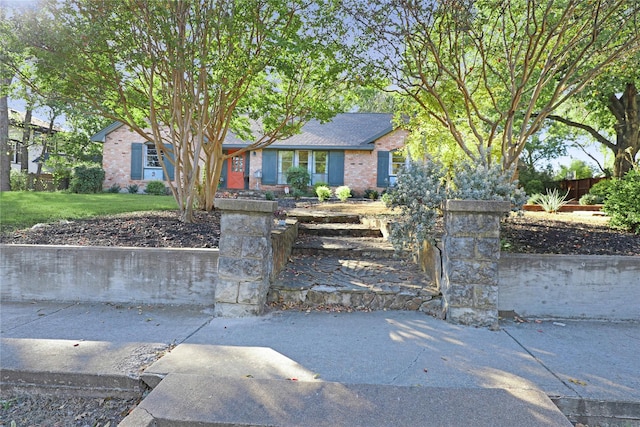 205 N College St, Mckinney, TX 75069 - view of front facade featuring brick siding