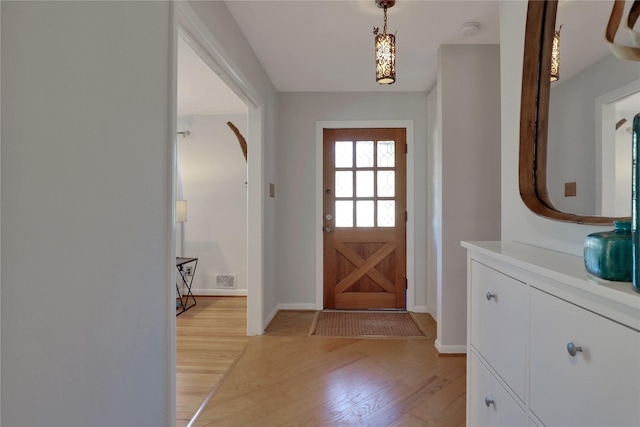 205 N College St, Mckinney, TX 75069 - foyer entrance with light wood-style floors and baseboards