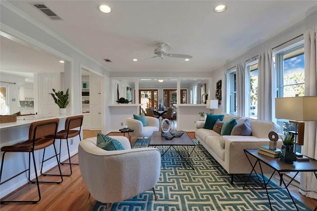205 N College St, Mckinney, TX 75069 - living area with a ceiling fan, light wood-type flooring, recessed lighting, and crown molding