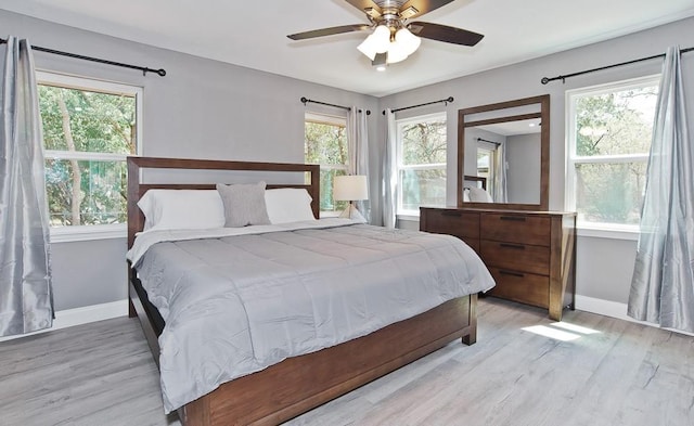 2908 Longfellow Ln, Denton, TX 76209 - bedroom featuring baseboards, light wood-type flooring, and ceiling fan