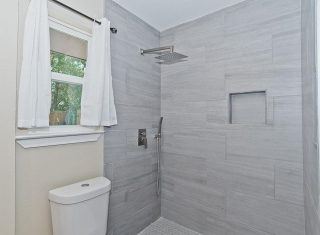 2908 Longfellow Ln, Denton, TX 76209 - full bathroom featuring a tile shower and toilet