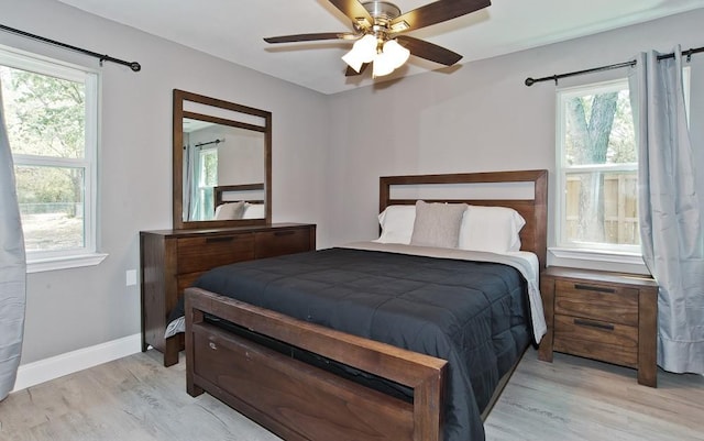 2908 Longfellow Ln, Denton, TX 76209 - bedroom with light wood-type flooring, baseboards, and a ceiling fan