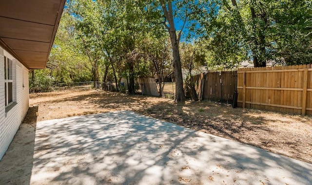 2908 Longfellow Ln, Denton, TX 76209 - fenced backyard featuring a patio