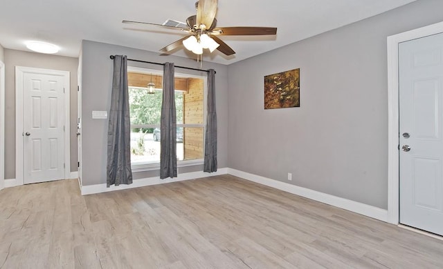 2908 Longfellow Ln, Denton, TX 76209 - empty room featuring light wood-style floors, ceiling fan, and baseboards