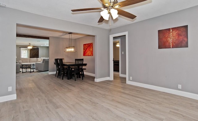 2908 Longfellow Ln, Denton, TX 76209 - dining room featuring light wood-style flooring, ceiling fan, and baseboards