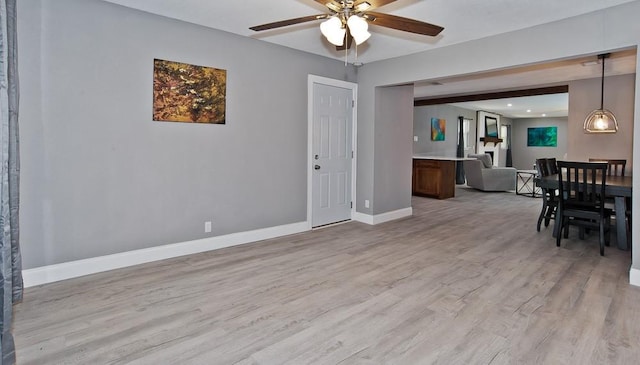2908 Longfellow Ln, Denton, TX 76209 - living area featuring ceiling fan, light wood-style floors, and baseboards