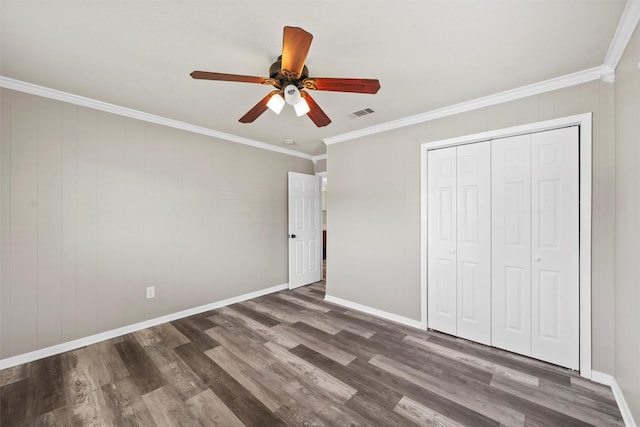 3412 Lisbon Dr, Waco, TX 76706 - unfurnished bedroom with wood finished floors, crown molding, a closet, ceiling fan, and baseboards