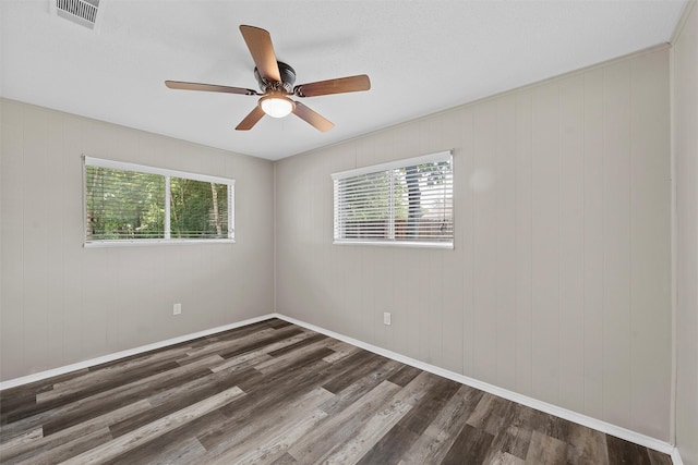 3412 Lisbon Dr, Waco, TX 76706 - unfurnished room featuring plenty of natural light, wood finished floors, a ceiling fan, and baseboards