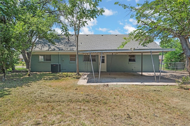 3412 Lisbon Dr, Waco, TX 76706 - rear view of house with central air condition unit, a patio, brick siding, a carport, and a shingled roof