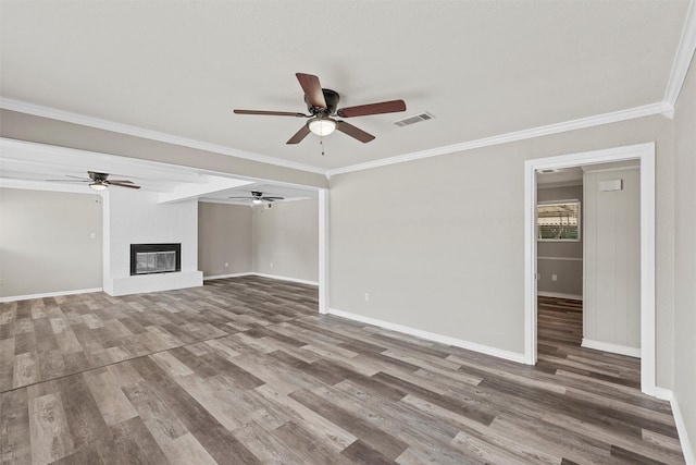 3412 Lisbon Dr, Waco, TX 76706 - unfurnished living room featuring a ceiling fan, wood finished floors, baseboards, and crown molding