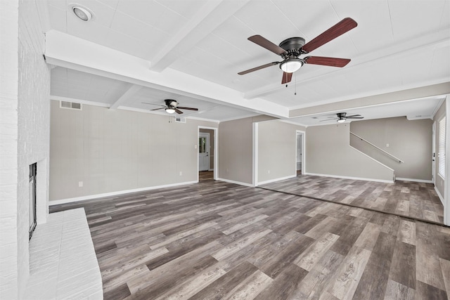 3412 Lisbon Dr, Waco, TX 76706 - unfurnished living room with beamed ceiling, baseboards, wood finished floors, ceiling fan, and a fireplace