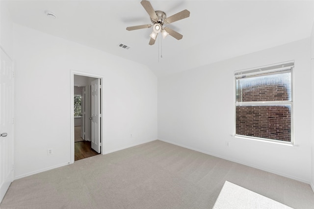 2442 Mackinac Dr, Frisco, TX 75033 - carpeted empty room featuring a ceiling fan, lofted ceiling, baseboards, and a smoke detector