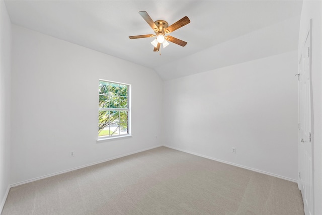 2442 Mackinac Dr, Frisco, TX 75033 - spare room with light carpet, ceiling fan, baseboards, and vaulted ceiling