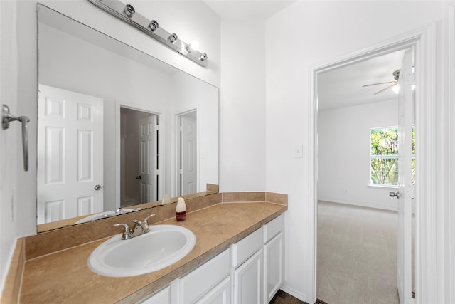 2442 Mackinac Dr, Frisco, TX 75033 - bathroom featuring vanity, ceiling fan, and baseboards