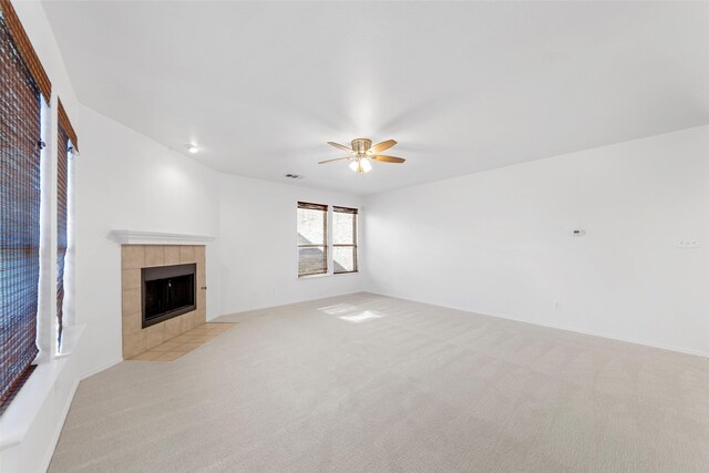 2442 Mackinac Dr, Frisco, TX 75033 - unfurnished living room with light carpet, ceiling fan, and a fireplace