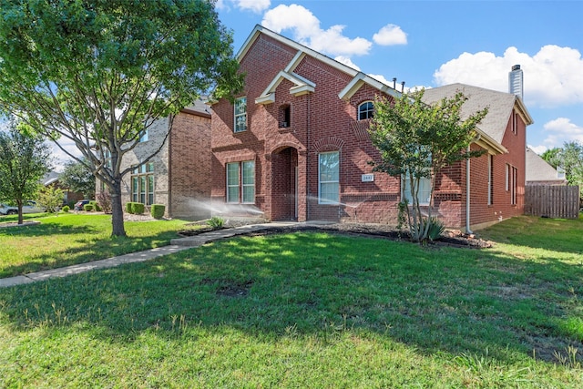 2442 Mackinac Dr, Frisco, TX 75033 - traditional-style house featuring a chimney and brick siding