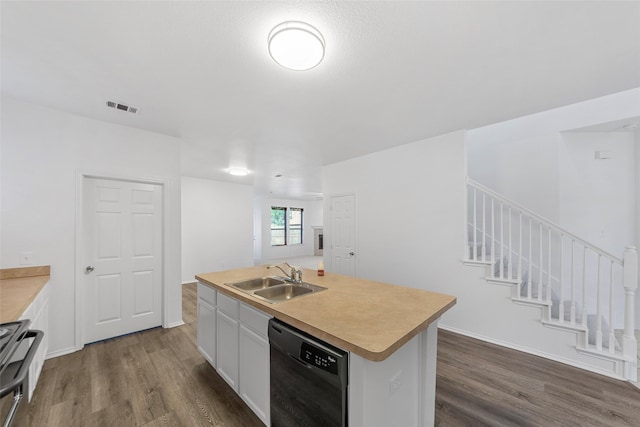 2442 Mackinac Dr, Frisco, TX 75033 - kitchen featuring black dishwasher, a sink, dark wood-style floors, and stove