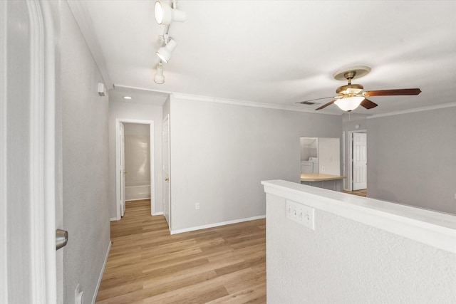 603 Plainview Dr, Mansfield, TX 76063 - hall with light wood-style flooring, baseboards, crown molding, and track lighting