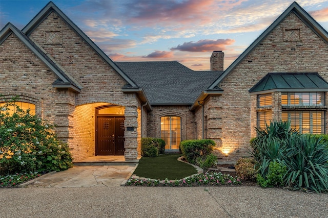 18602 Turnbridge Dr, Dallas, TX 75252 - view of front of home featuring brick siding, a chimney, and roof with shingles