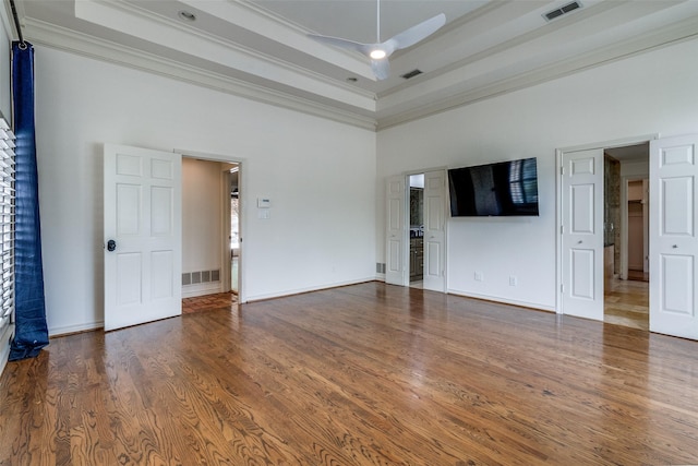 18602 Turnbridge Dr, Dallas, TX 75252 - unfurnished living room with crown molding, a towering ceiling, ceiling fan, wood finished floors, and a tray ceiling