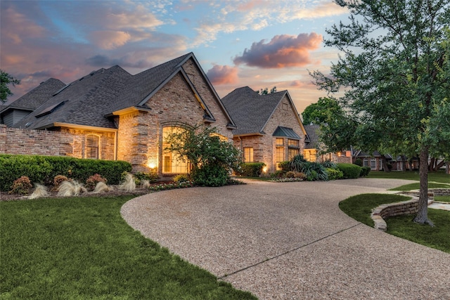 18602 Turnbridge Dr, Dallas, TX 75252 - view of front of home featuring brick siding, a yard, and roof with shingles