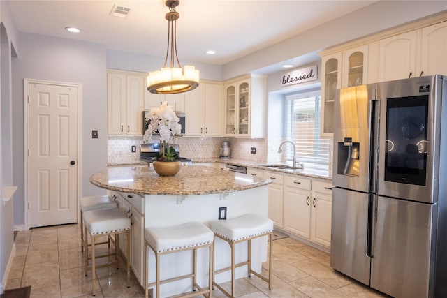 1421 Eugene Dr, Wylie, TX 75098 - kitchen featuring stainless steel refrigerator with ice dispenser, a sink, light tile patterned floors, tasteful backsplash, and recessed lighting