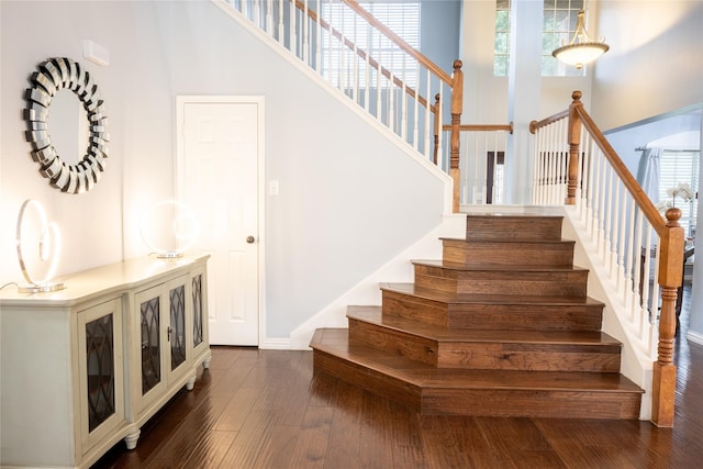 1421 Eugene Dr, Wylie, TX 75098 - stairway with a towering ceiling, hardwood / wood-style floors, and baseboards