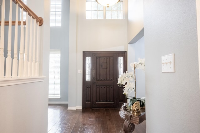1421 Eugene Dr, Wylie, TX 75098 - foyer entrance featuring a towering ceiling, hardwood / wood-style floors, and baseboards