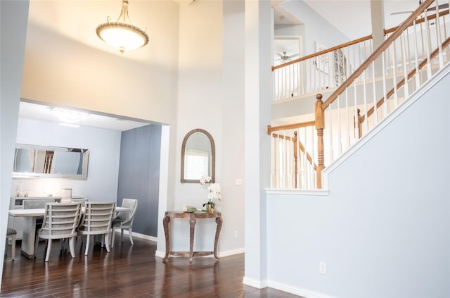 1421 Eugene Dr, Wylie, TX 75098 - dining room with wood finished floors, a towering ceiling, baseboards, stairs, and a ceiling fan
