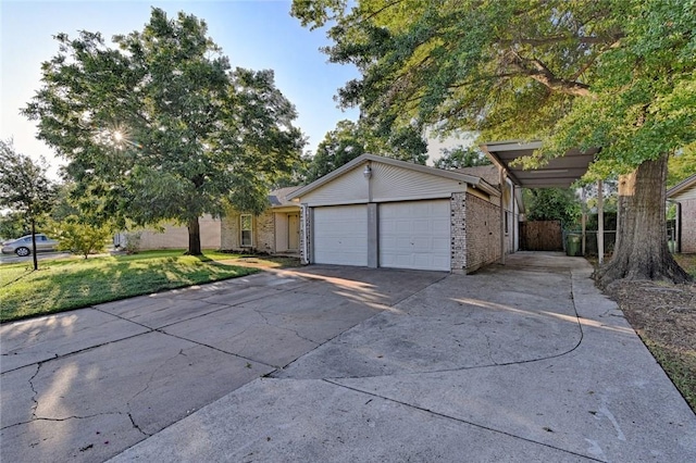 2900 Lachelle Ln, Arlington, TX 76010 - view of front facade featuring an attached garage, driveway, and brick siding