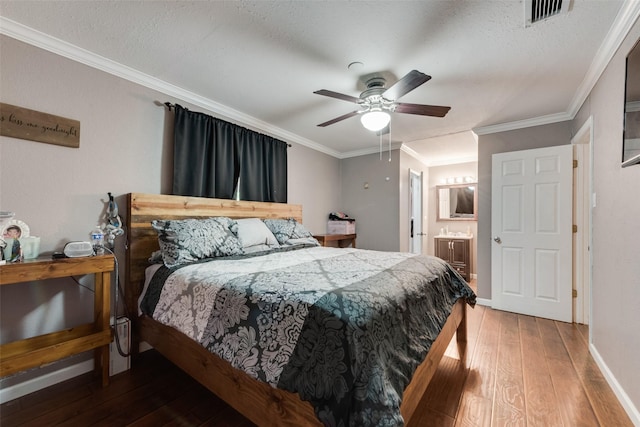 2900 Lachelle Ln, Arlington, TX 76010 - bedroom featuring hardwood / wood-style flooring, crown molding, baseboards, ensuite bathroom, and a ceiling fan