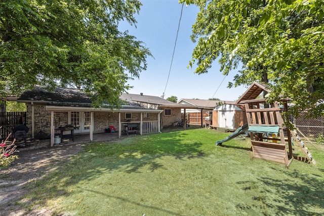 2900 Lachelle Ln, Arlington, TX 76010 - view of yard with french doors, a playground, and a patio area