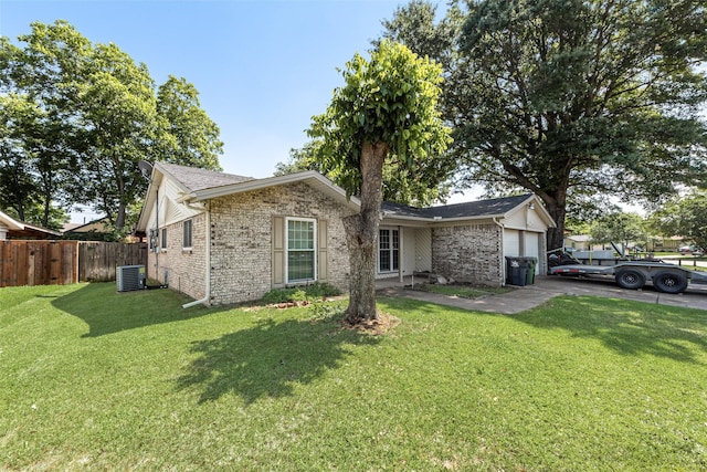 2900 Lachelle Ln, Arlington, TX 76010 - view of front facade with an attached garage, brick siding, and central air condition unit