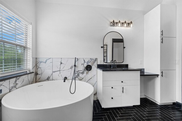 4160 Towne Green Cir, Addison, TX 75001 - bathroom with vanity, a freestanding tub, tile walls, and a wainscoted wall