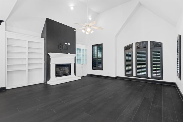 4160 Towne Green Cir, Addison, TX 75001 - unfurnished living room featuring ceiling fan, vaulted ceiling, wood finished floors, a glass covered fireplace, and baseboards