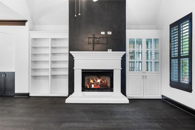 4160 Towne Green Cir, Addison, TX 75001 - unfurnished living room with a lit fireplace, baseboards, and wood finished floors