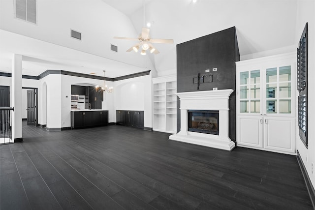 4160 Towne Green Cir, Addison, TX 75001 - unfurnished living room with ceiling fan, a glass covered fireplace, a chandelier, baseboards, and dark wood-style flooring