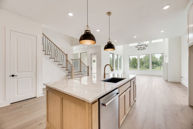 3340 Crescent Ln, Celina, TX 75009 - kitchen featuring stainless steel dishwasher, light wood-style flooring, recessed lighting, pendant lighting, and light stone counters