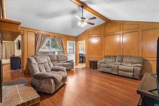 4206 Windhurst Dr, Arlington, TX 76015 - living area featuring a ceiling fan, wood finished floors, a textured ceiling, and a decorative wall