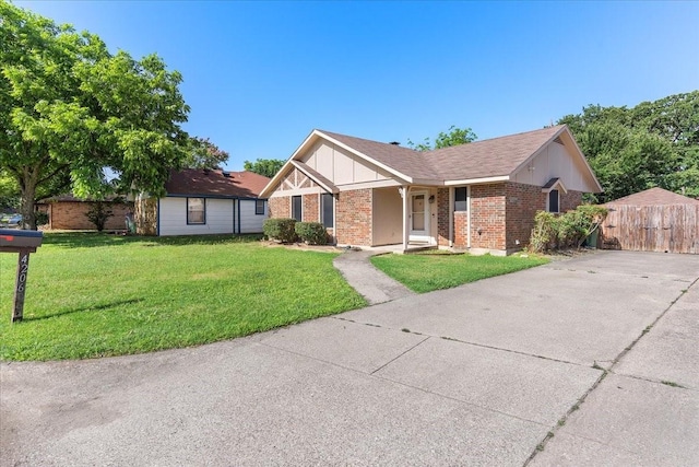 4206 Windhurst Dr, Arlington, TX 76015 - view of front of home featuring brick siding, board and batten siding, and concrete driveway