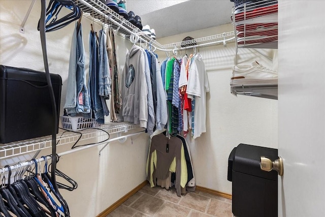 4206 Windhurst Dr, Arlington, TX 76015 - walk in closet with stone finish flooring