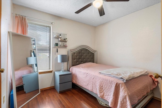 4206 Windhurst Dr, Arlington, TX 76015 - bedroom featuring wood finished floors, ceiling fan, baseboards, and a textured ceiling