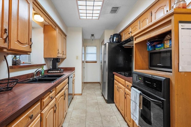 4206 Windhurst Dr, Arlington, TX 76015 - kitchen featuring a sink, oven, under cabinet range hood, dishwasher, and baseboards