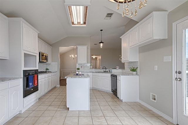 1223 Hampton Bay Dr, Rockwall, TX 75087 - kitchen featuring black appliances, a chandelier, decorative backsplash, vaulted ceiling, and a sink