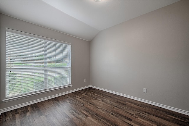 1223 Hampton Bay Dr, Rockwall, TX 75087 - spare room featuring lofted ceiling, dark wood finished floors, and baseboards
