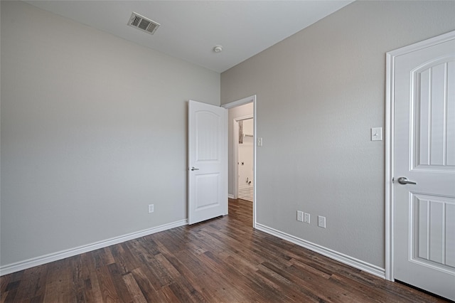1223 Hampton Bay Dr, Rockwall, TX 75087 - unfurnished bedroom with dark wood-style floors and baseboards
