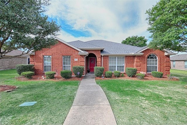 1223 Hampton Bay Dr, Rockwall, TX 75087 - view of front of home featuring brick siding, a front lawn, and a shingled roof