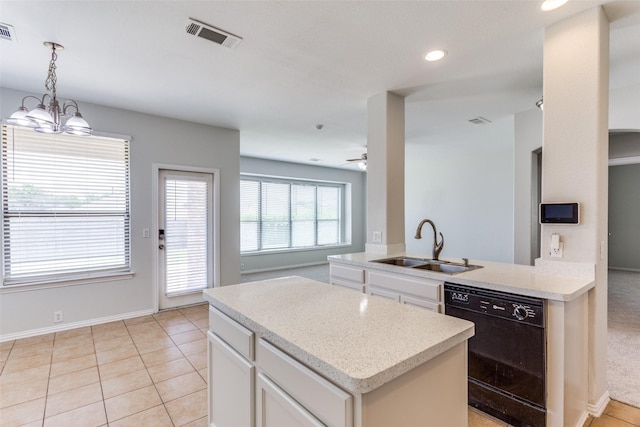 536 Kerry St, Crowley, TX 76036 - kitchen featuring dishwasher, a sink, a center island, white cabinets, and hanging light fixtures