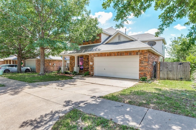 536 Kerry St, Crowley, TX 76036 - traditional-style home with brick siding, an attached garage, concrete driveway, roof with shingles, and a gate