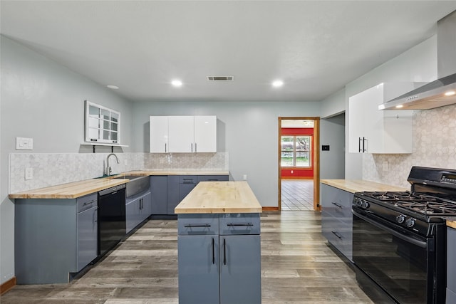 1317 Elby St, Irving, TX 75061 - kitchen featuring wood counters, black appliances, a sink, decorative backsplash, and recessed lighting
